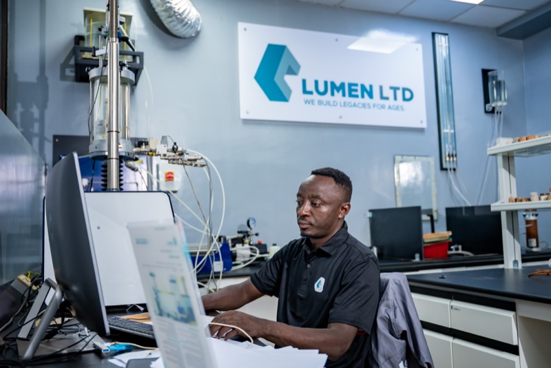 Laboratory specialist reviewing test data at a workstation
