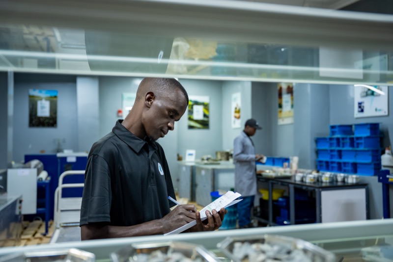 Laboratory specialist recording observations in the aggregates room
