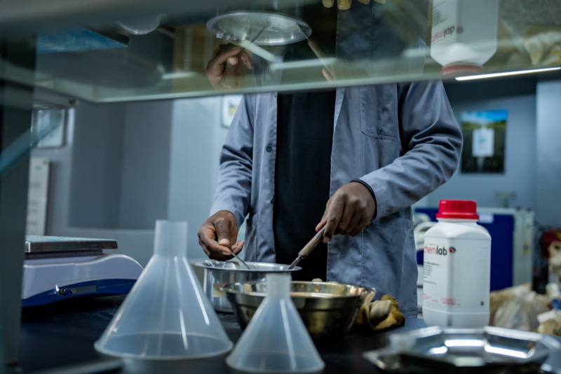 Technician mixing a sample at the preparation bench