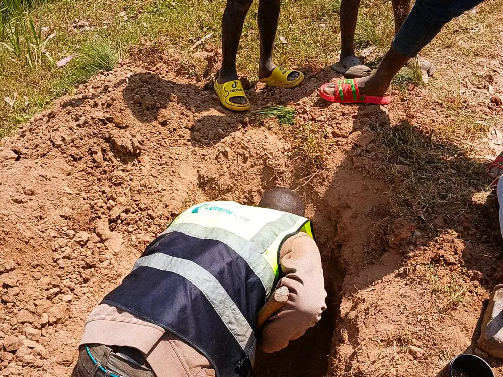 LUMEN technician logging a trial pit at an investigation point